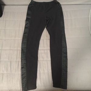 Black leggings. Faux leather up sides.